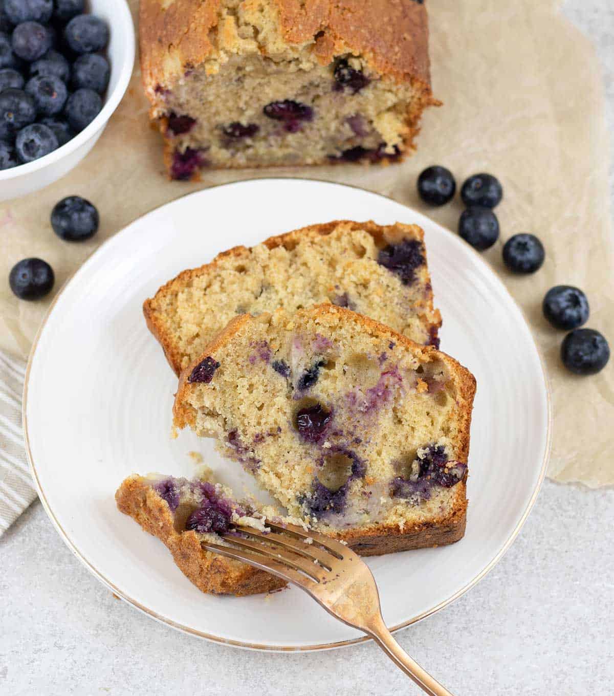 cut the Blueberry Banana Bread and some blueberries around it.