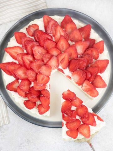 Cut a slice of the french strawberry tart.