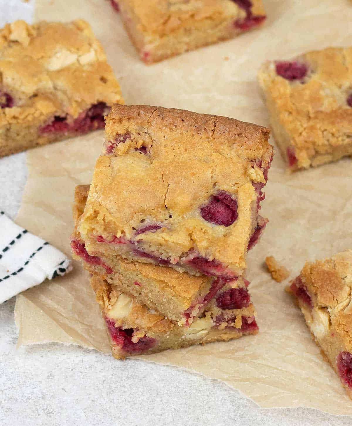 a pile of White Chocolate and Raspberry Blondies.