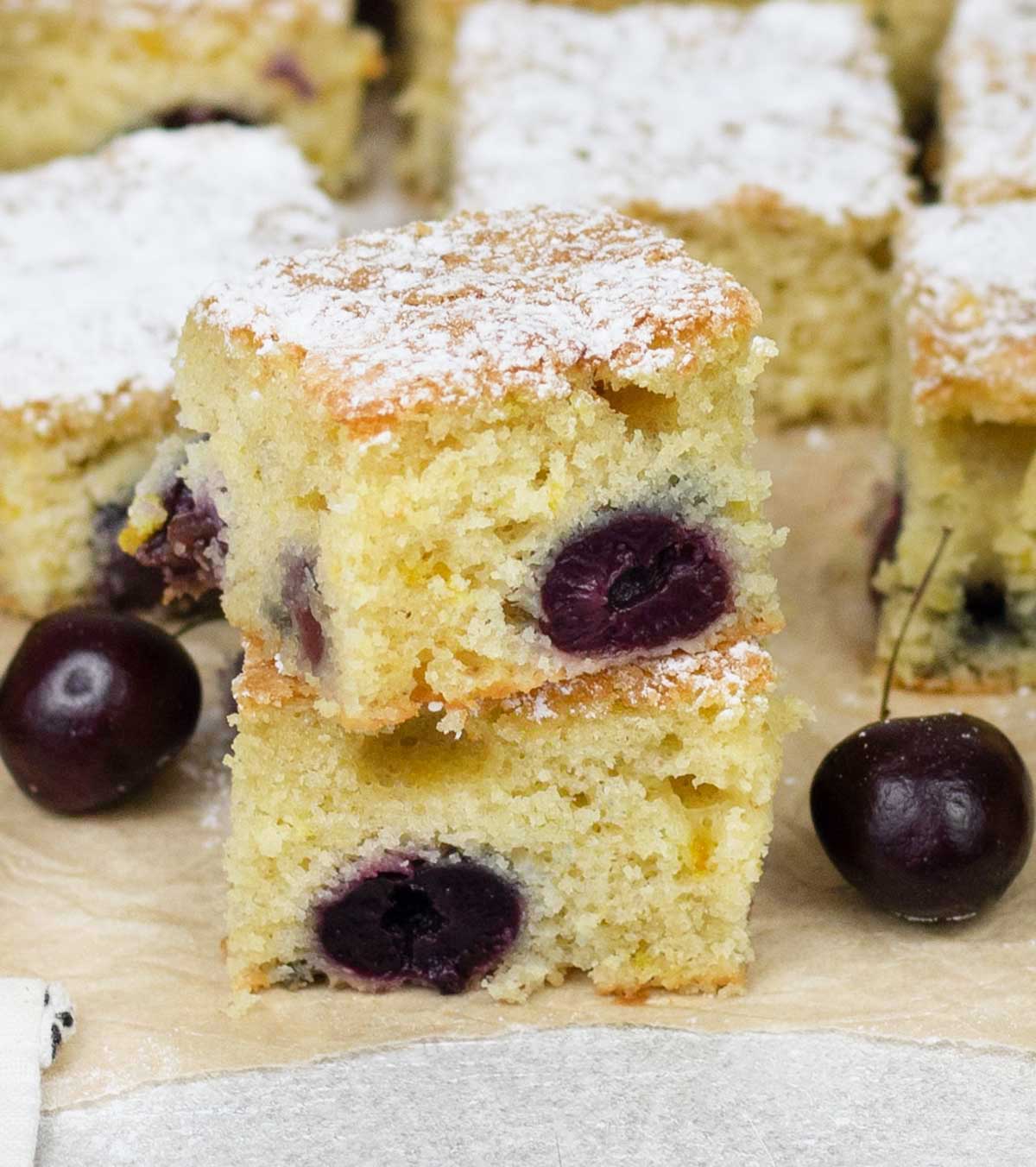 Cherry cake and some fresh cherries.