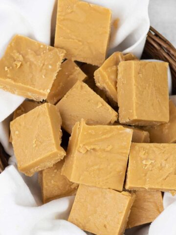 Peanut butter fudge squares in a small food basket.