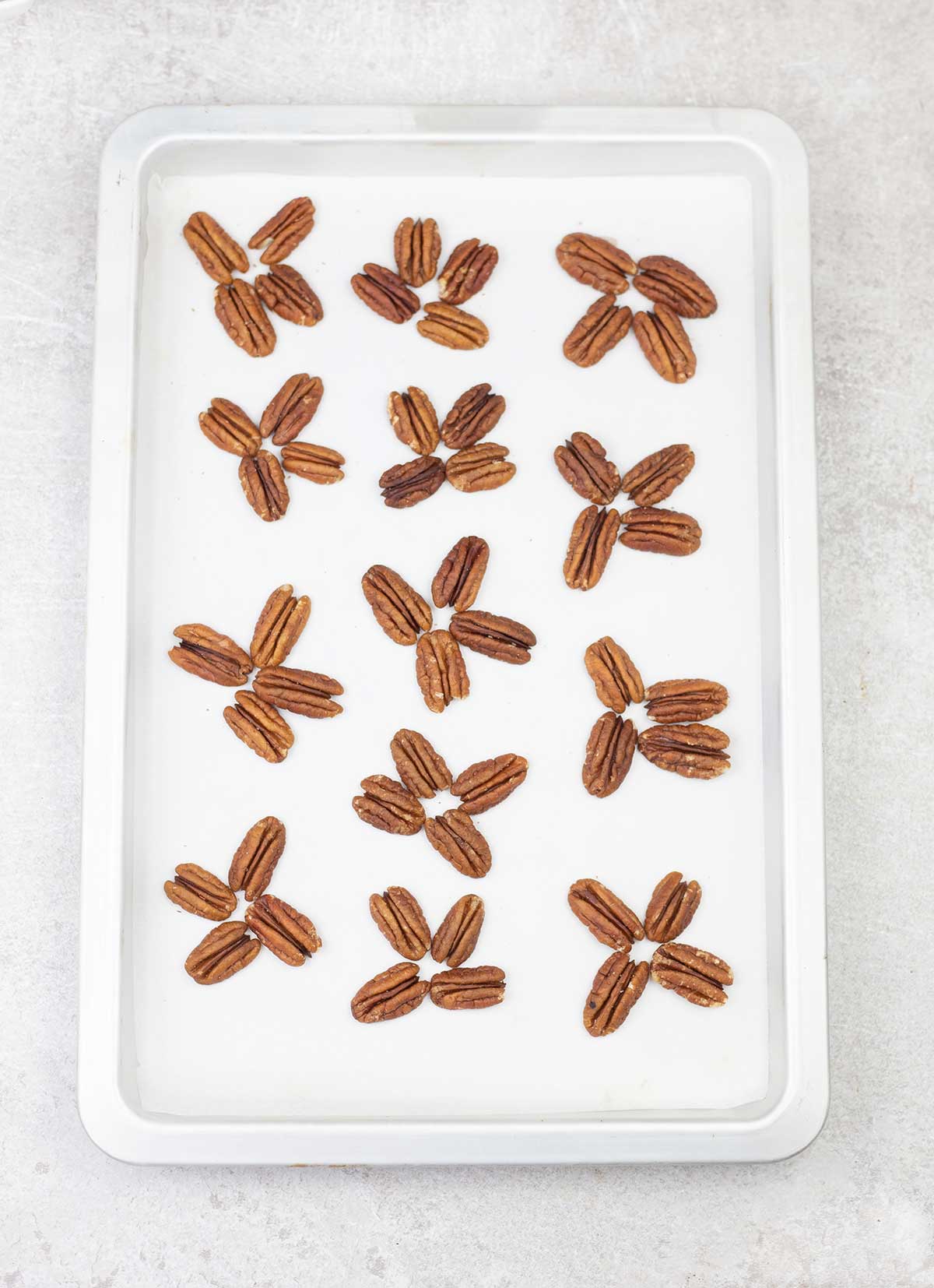 Arrange every 4 pecans together in a cluster.