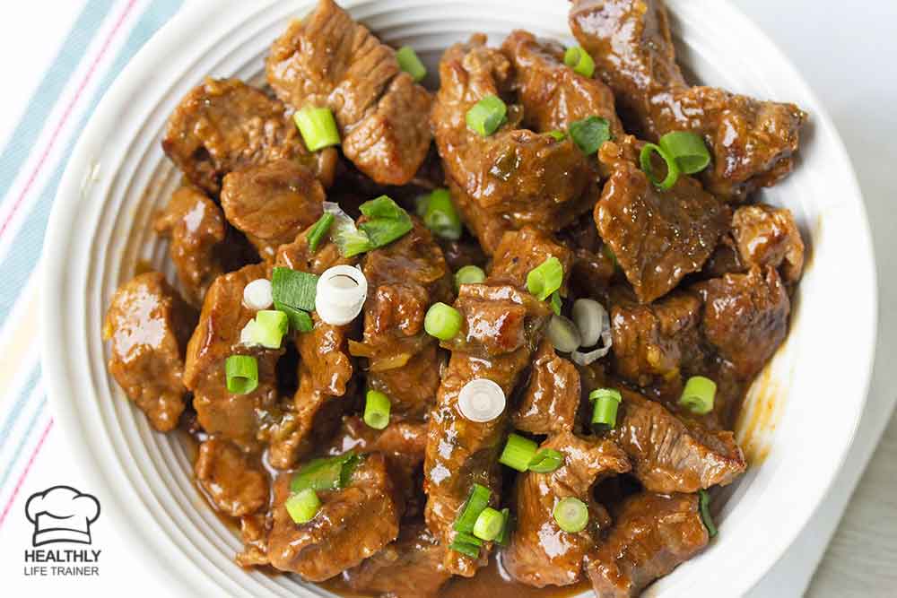 Chinese chilli beef topped with spring onion.