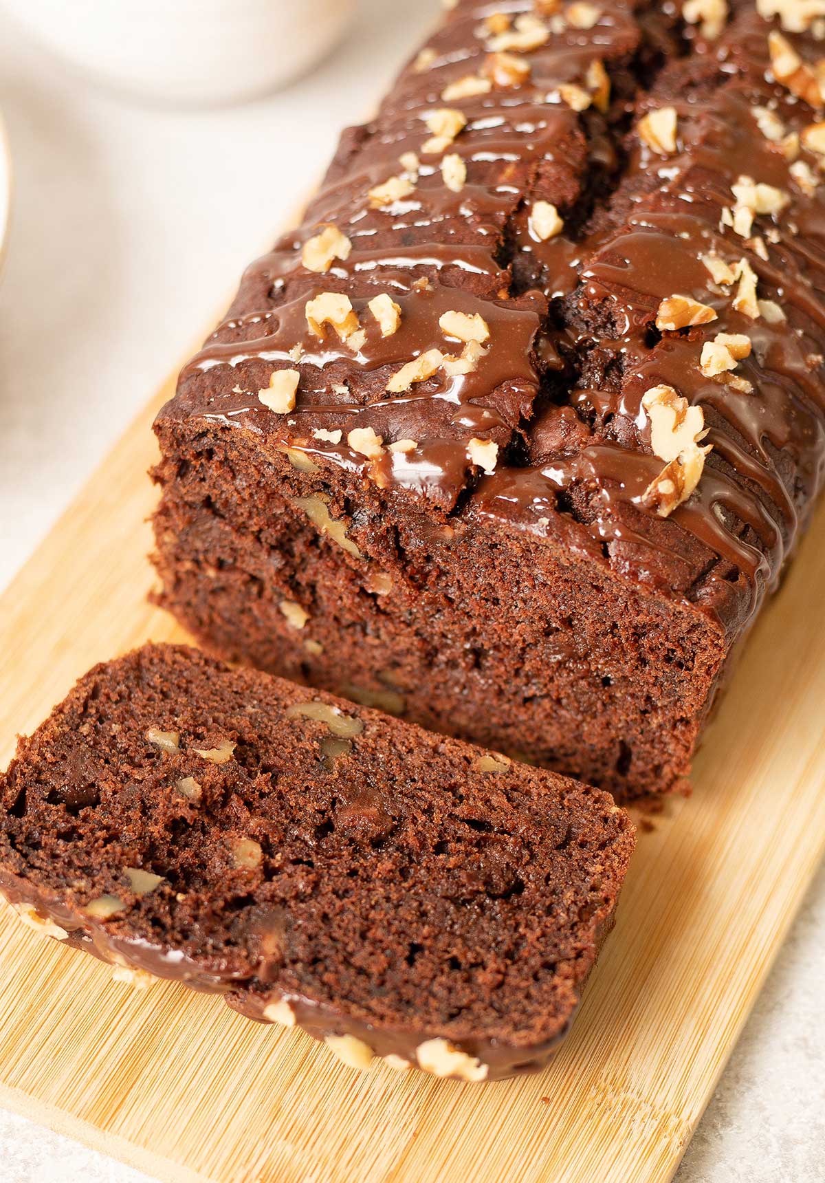 chocolate banana nut bread on a chopping board.