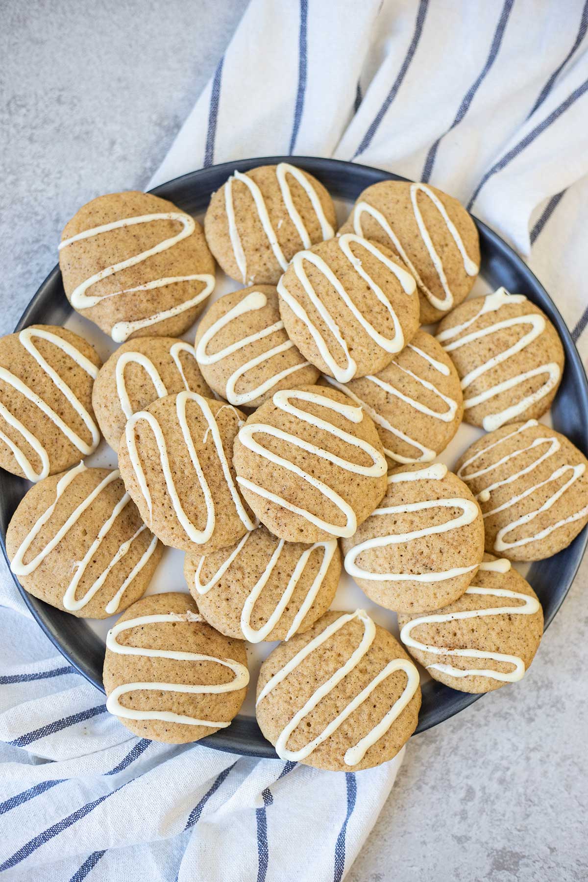 A plate full of soft eggnog cookies.