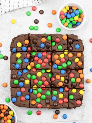 M&M cookie bars with loads of M&M's around them.