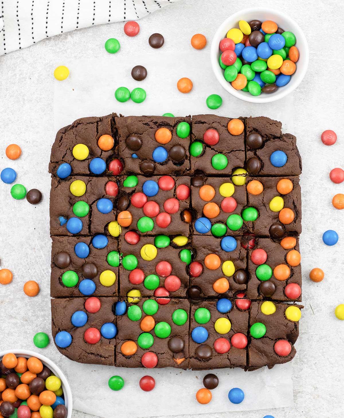 M&M cookie bars with loads of M&M's around them.