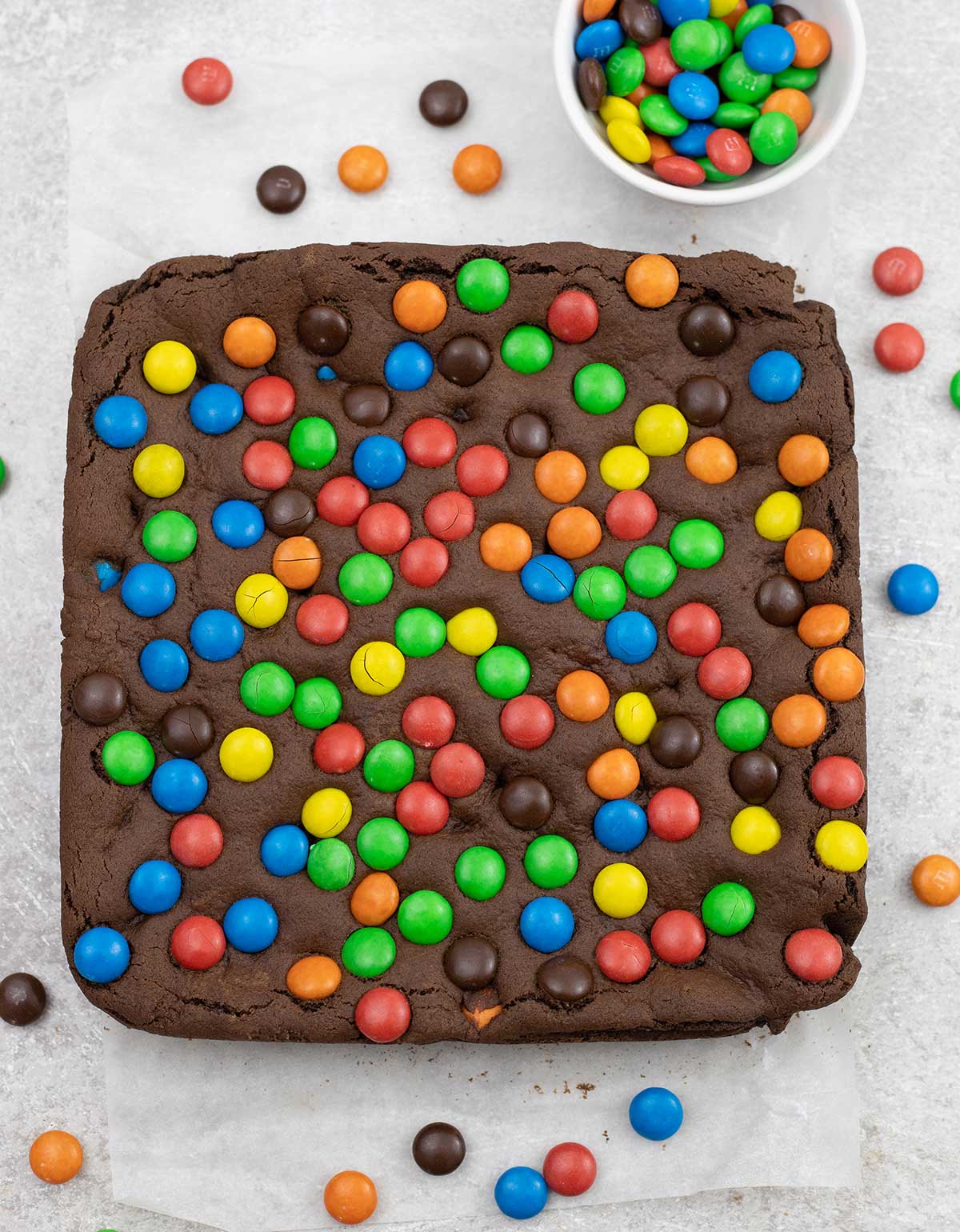 M&M cookie bars and a small bowl of M&M's.