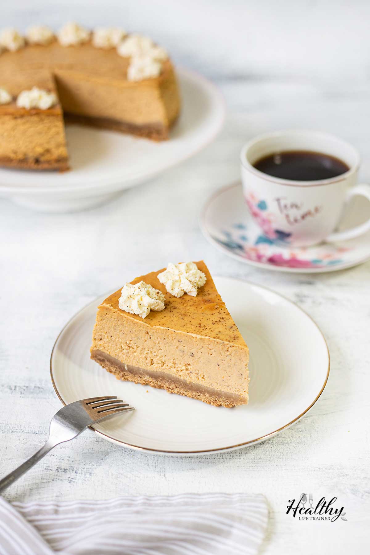 Philadelphia pumpkin cheesecake slice in a plate.