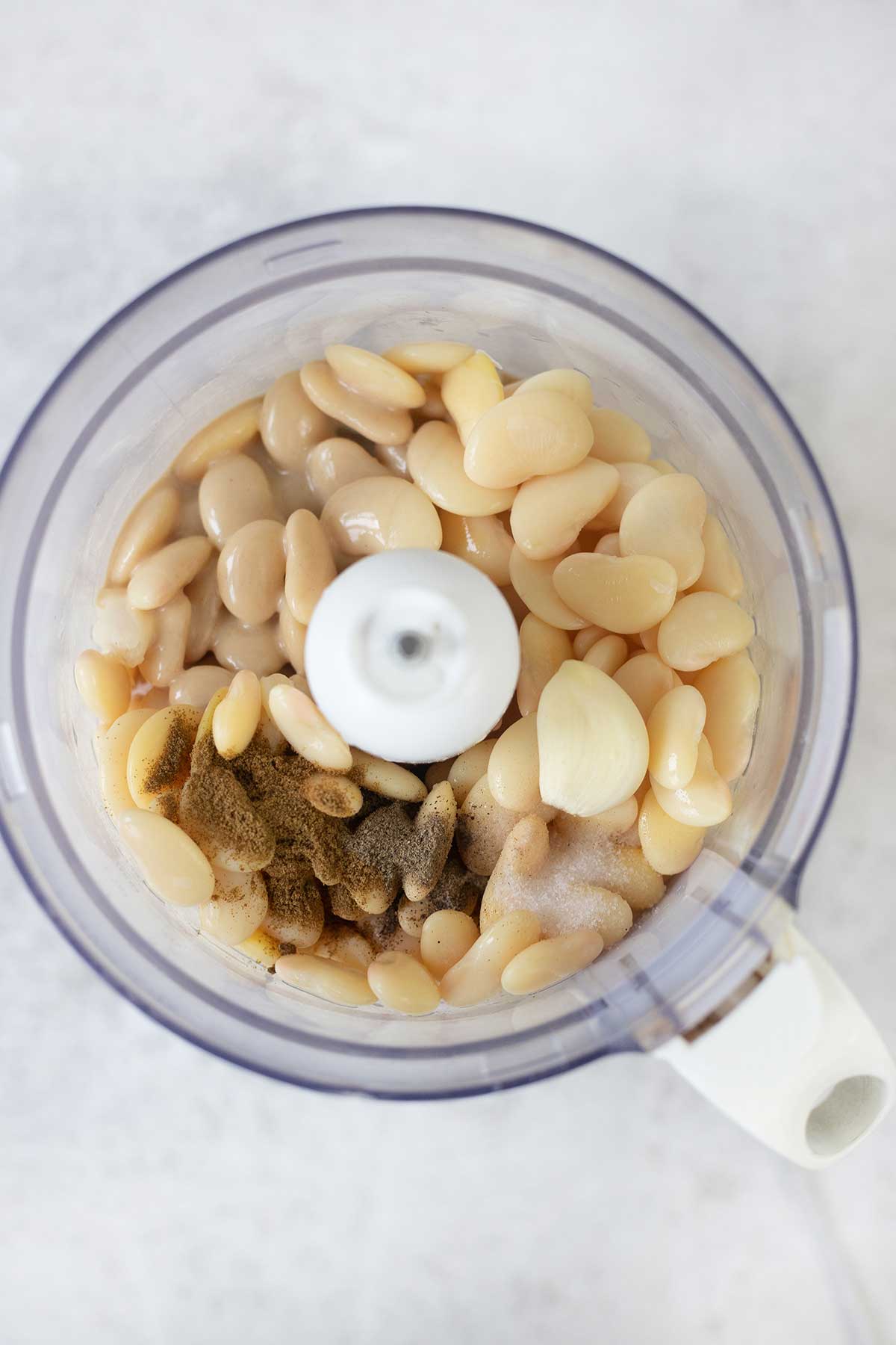 White beans, tahini and other ingredients in the food processor.