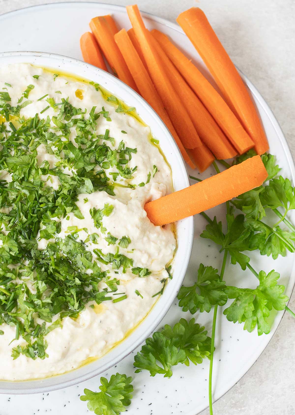 Butter bean hummus and a carrot stick.