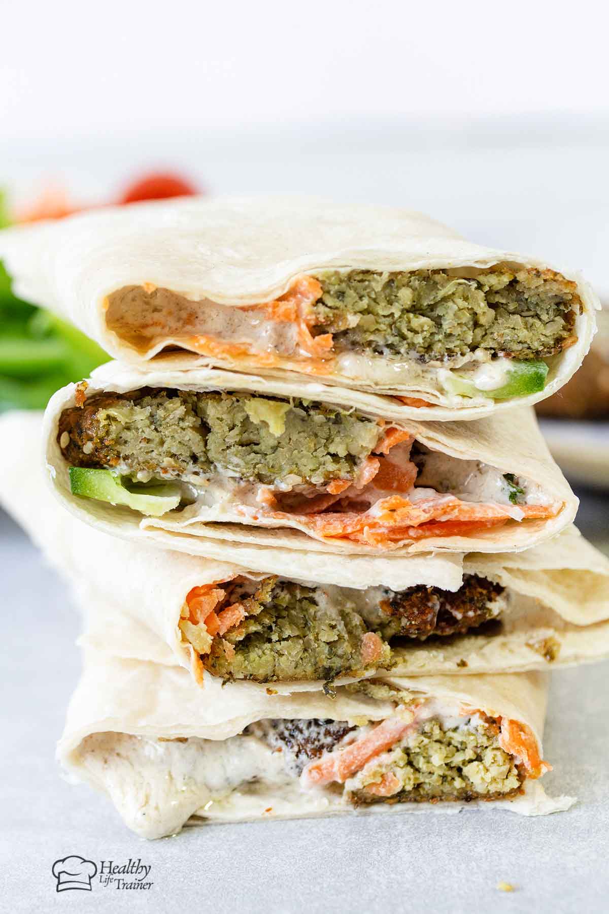 Lebanese Falafel wraps topped with tahini sauce.