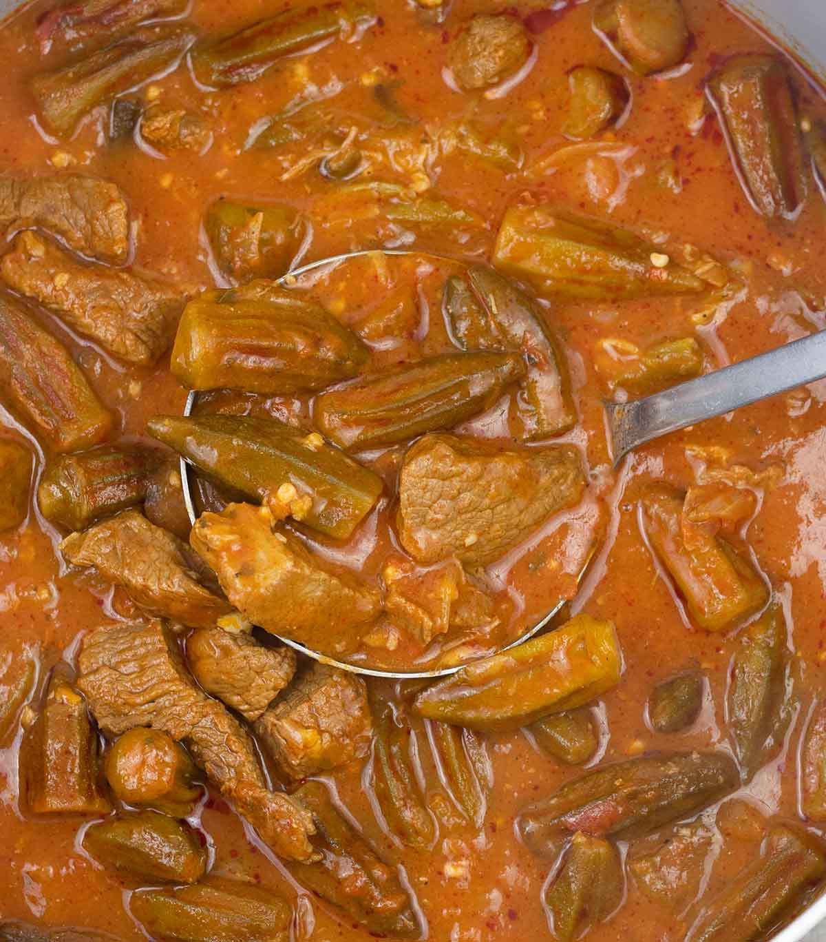 Bamya (okra stew) with beef in a serving bowl.