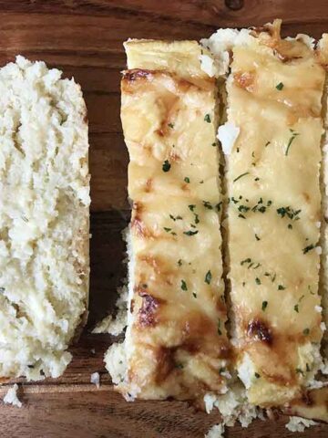 Cutting the cauliflower cheese bread.