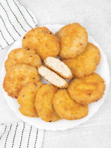 Crispy chicken patties in a plate.