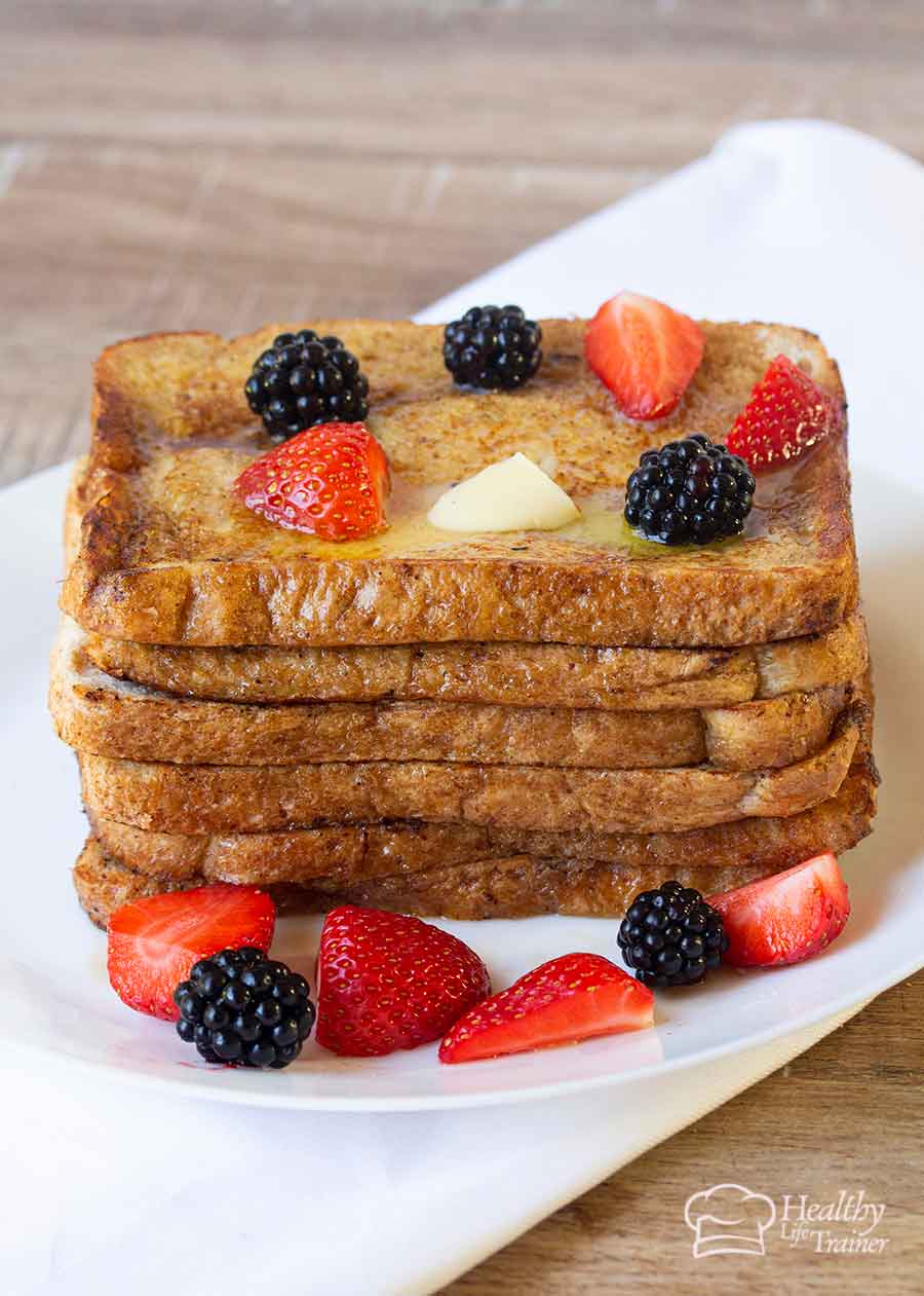 French toast topped with butter and fresh berries.