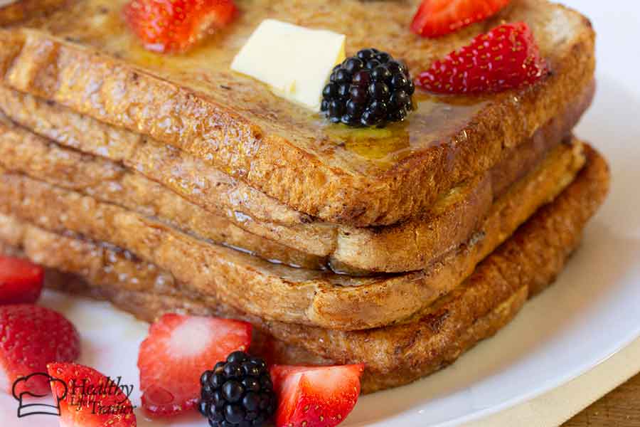 French toast topped with butter and fresh berries.