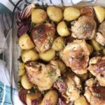 Chicken and potato casserole topped with fresh thyme.