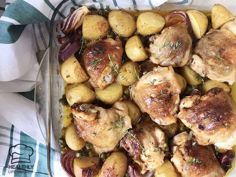 Chicken and potato casserole topped with fresh thyme.