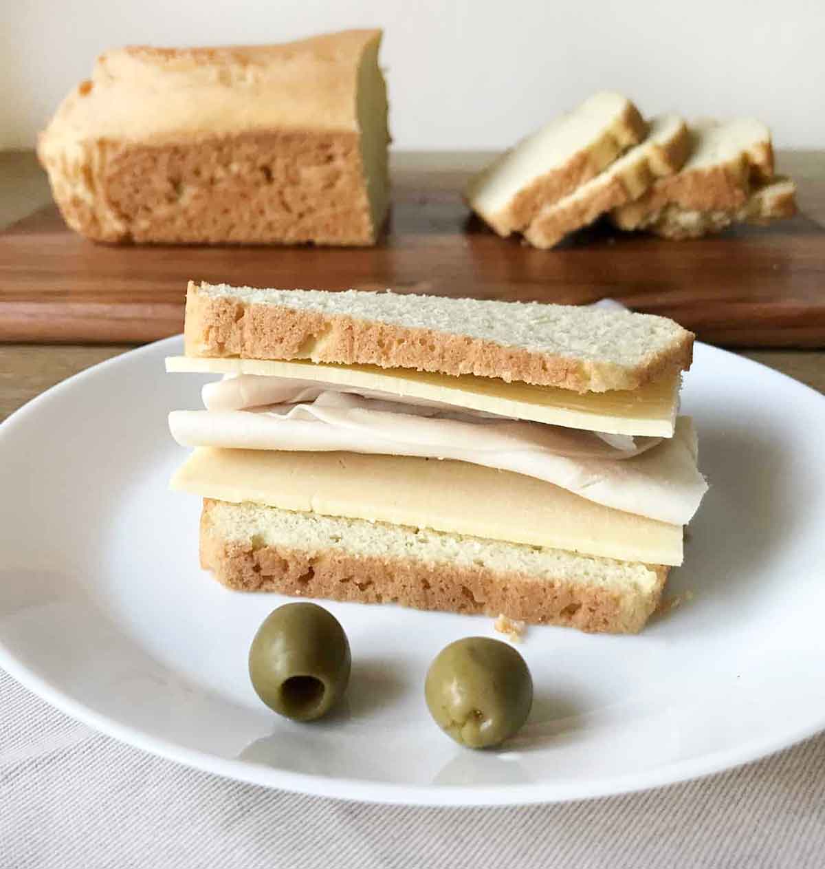 Homemade gluten-free keto bread making sandwich.