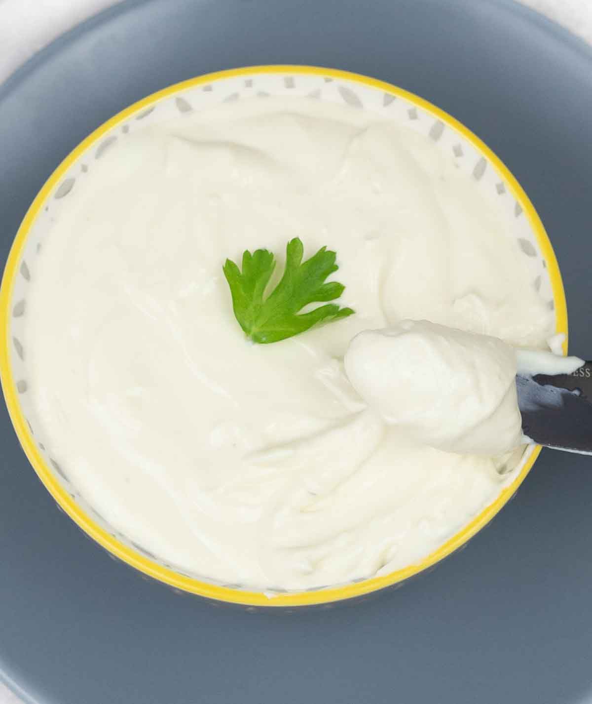 Homemade cream cheese in a bowl.