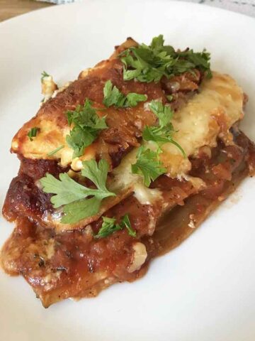 Keto no noodle eggplant lasagna in a serving plate.