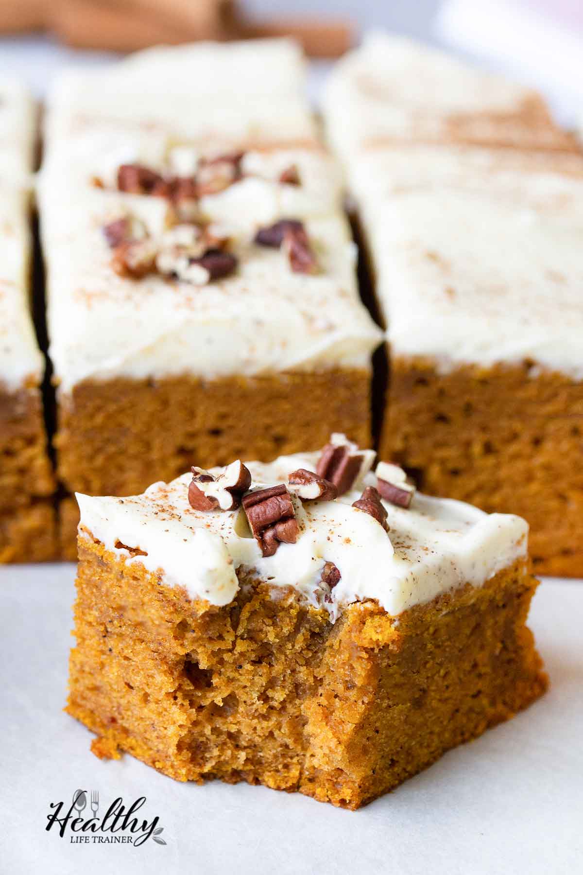 Eat a slice of pumpkin sheet cake with cream cheese frosting