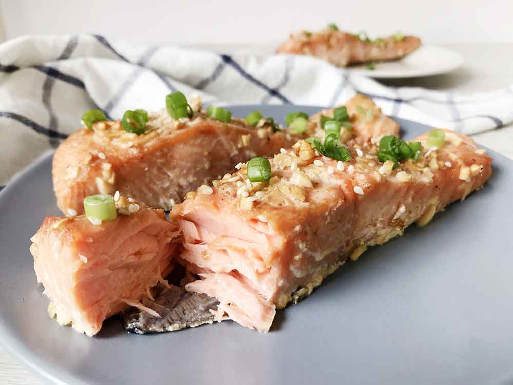 Cut the baked honey glazed salmon.