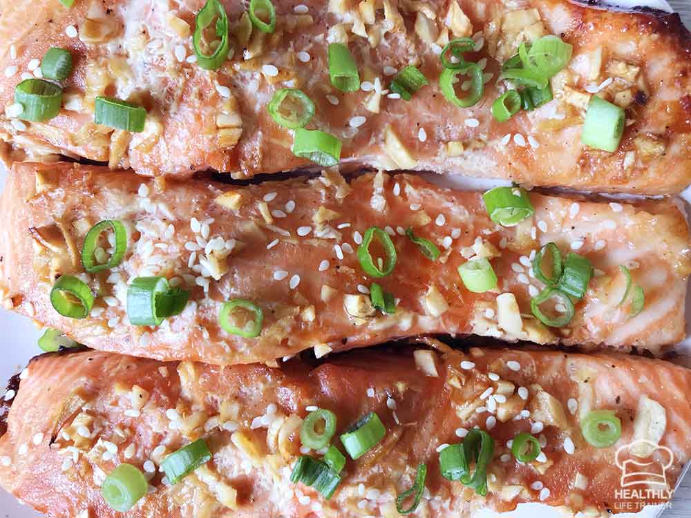 Baked honey glazed salmon topped with sesame seeds.