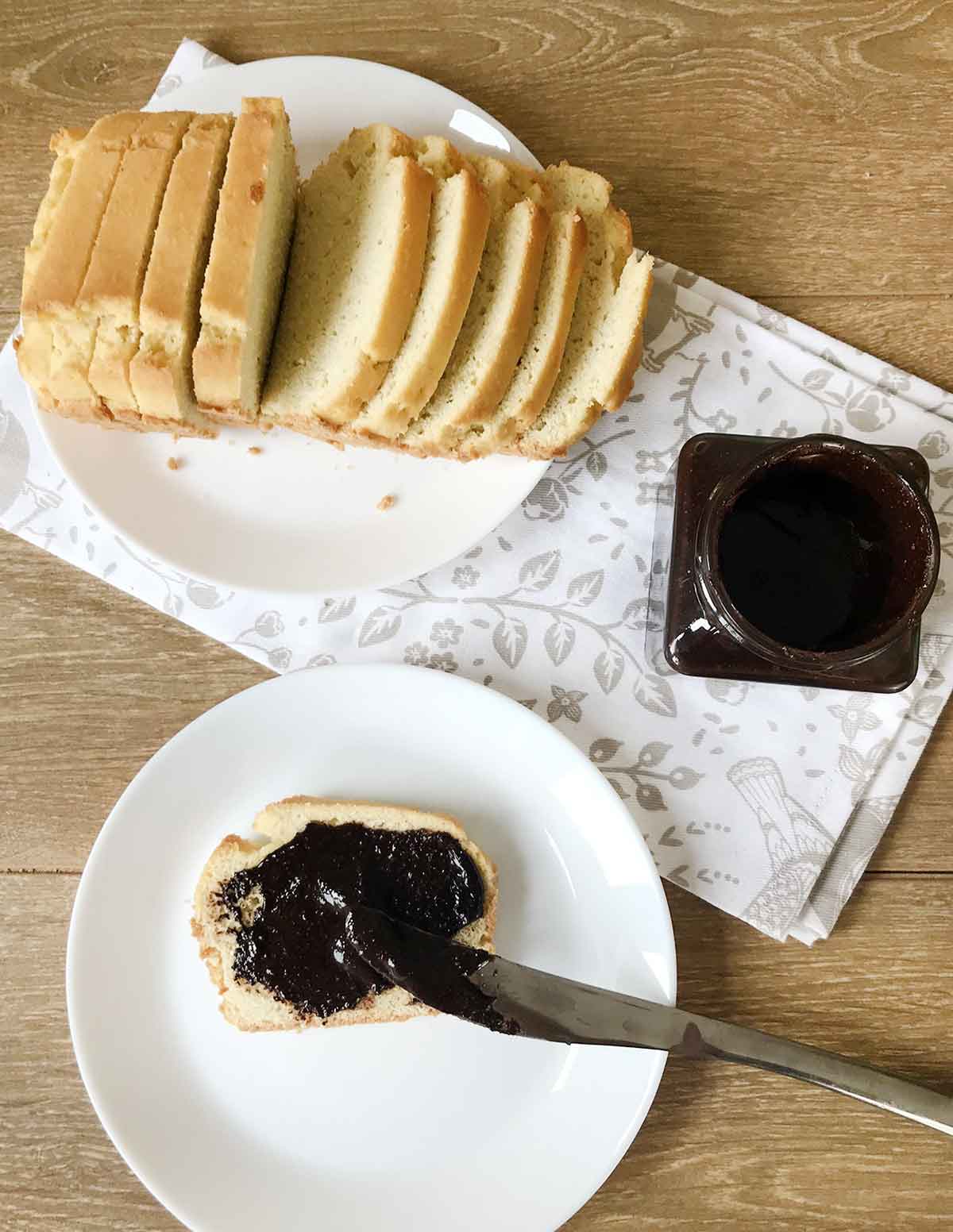 Spreading the keto Nutella on a slice of keto bread.