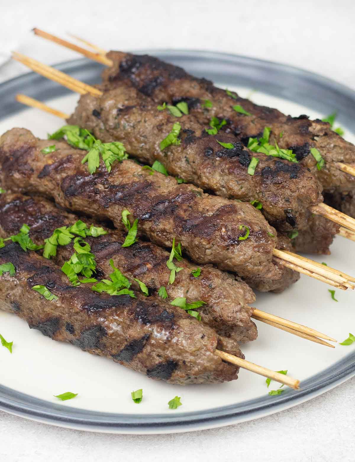 Indian lamb seekh kebab on skewers.