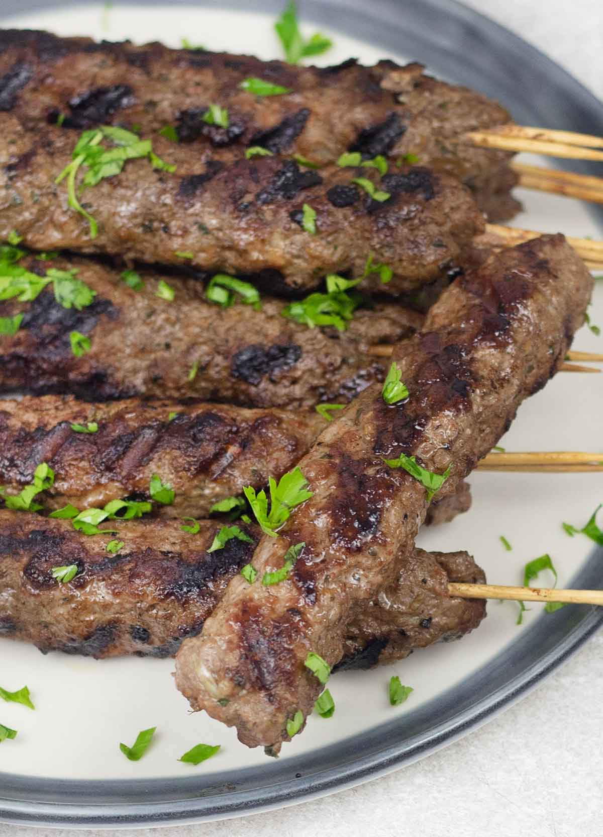 Indian lamb seekh kebab garnished with parsley.