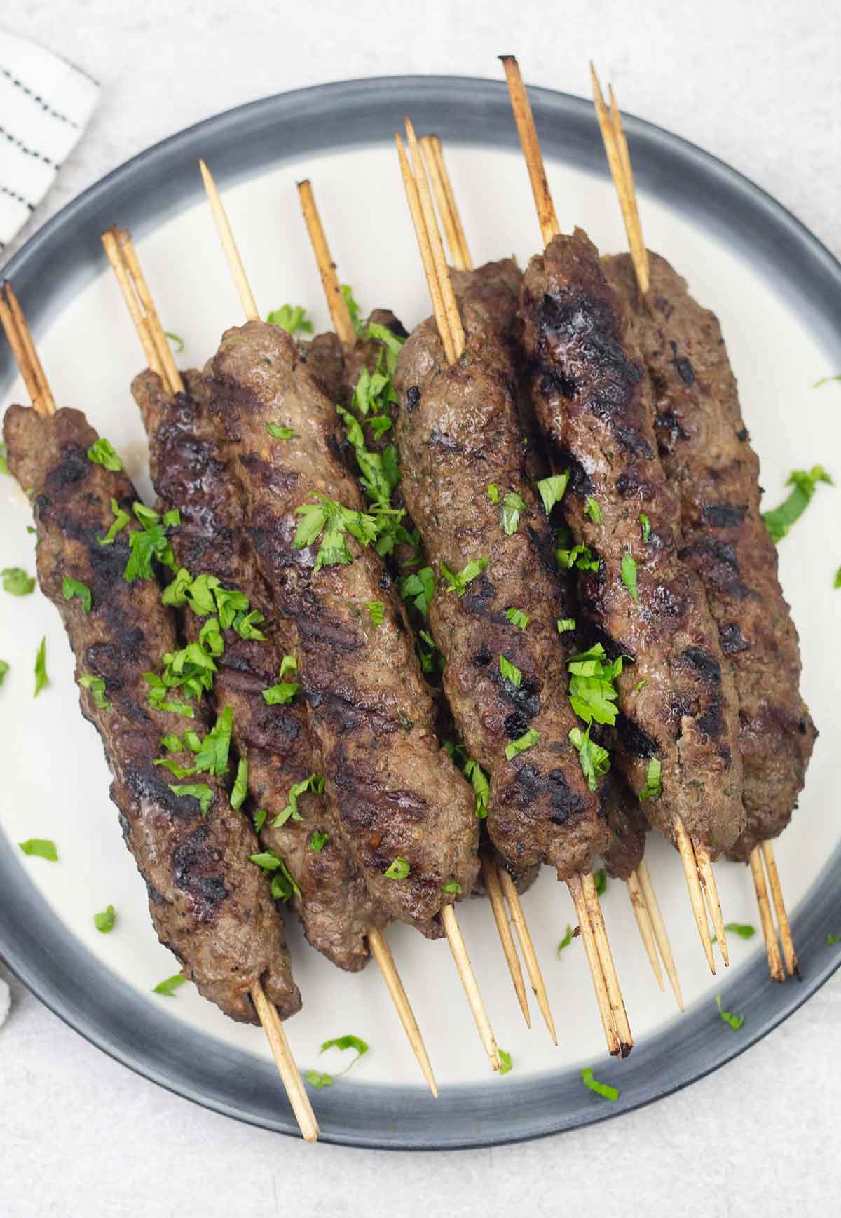 Indian lamb seekh kebab on a plate.