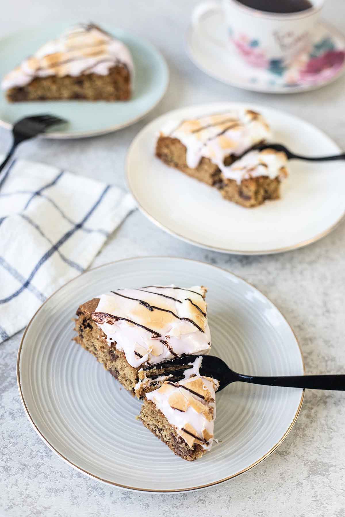 An individual slices of S'mores cookie cake in plates.