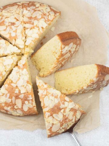 Italian almond cake slices topped with almond flakes.