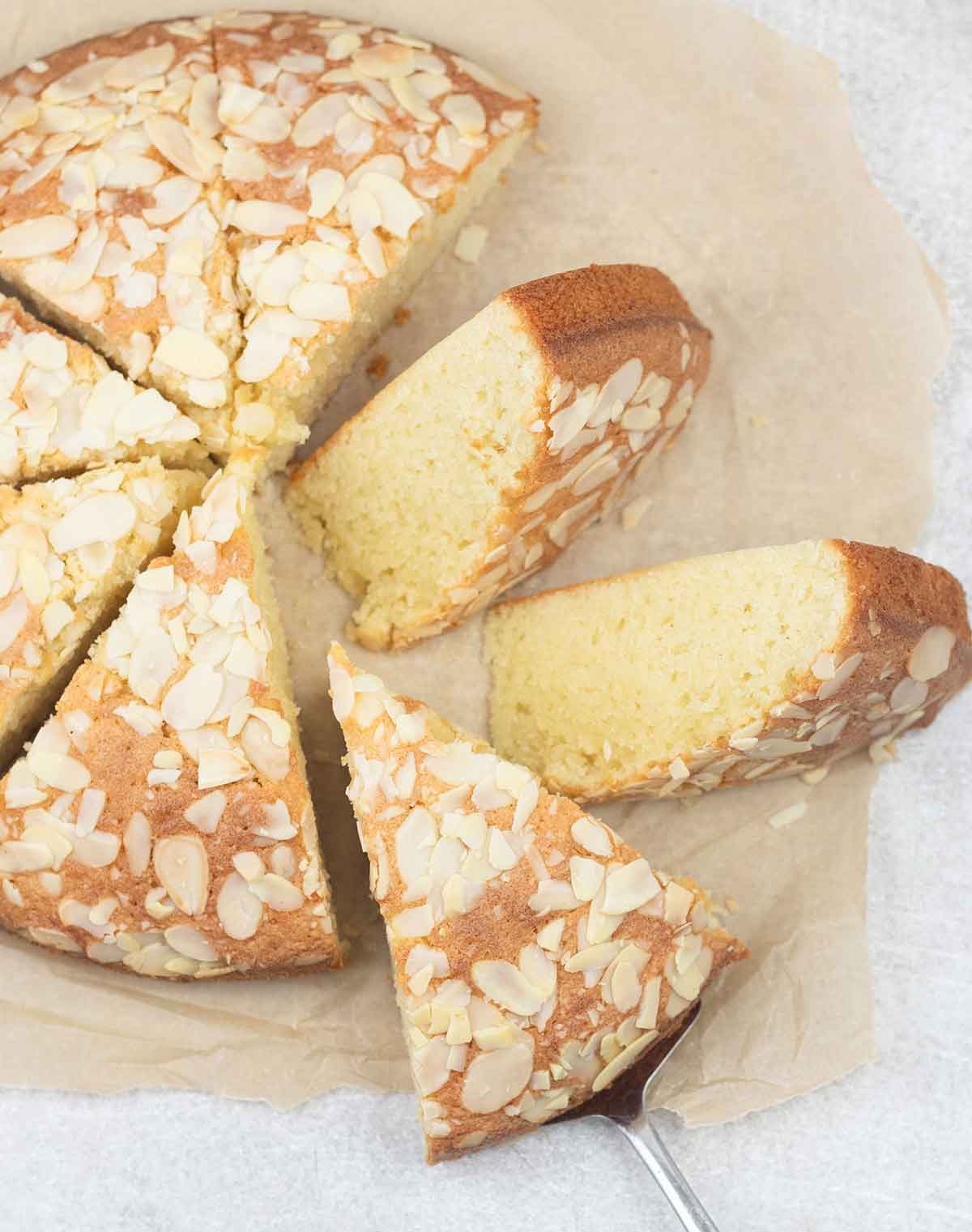 Italian almond cake slices topped with almond flakes.