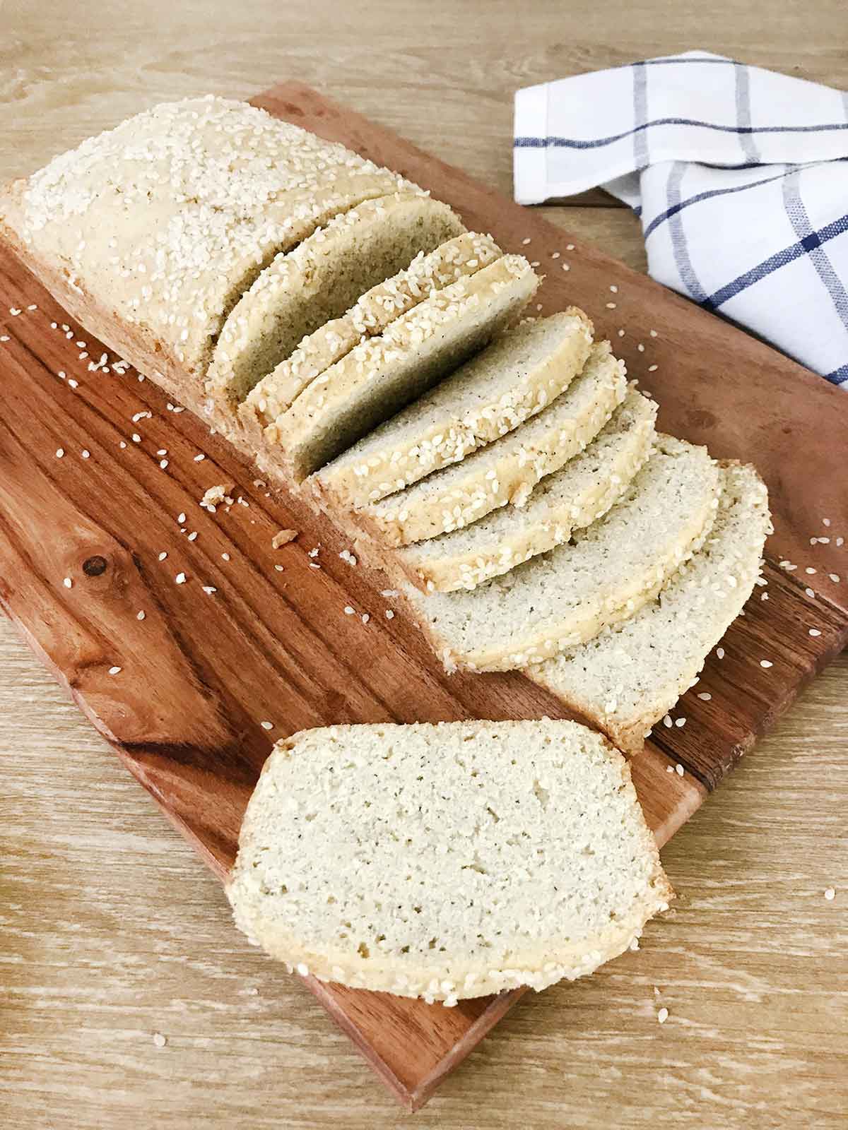 keto sesame bread on a chopping board.