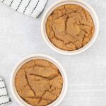 2 eggless peanut butter microwave cookies in ramekins.