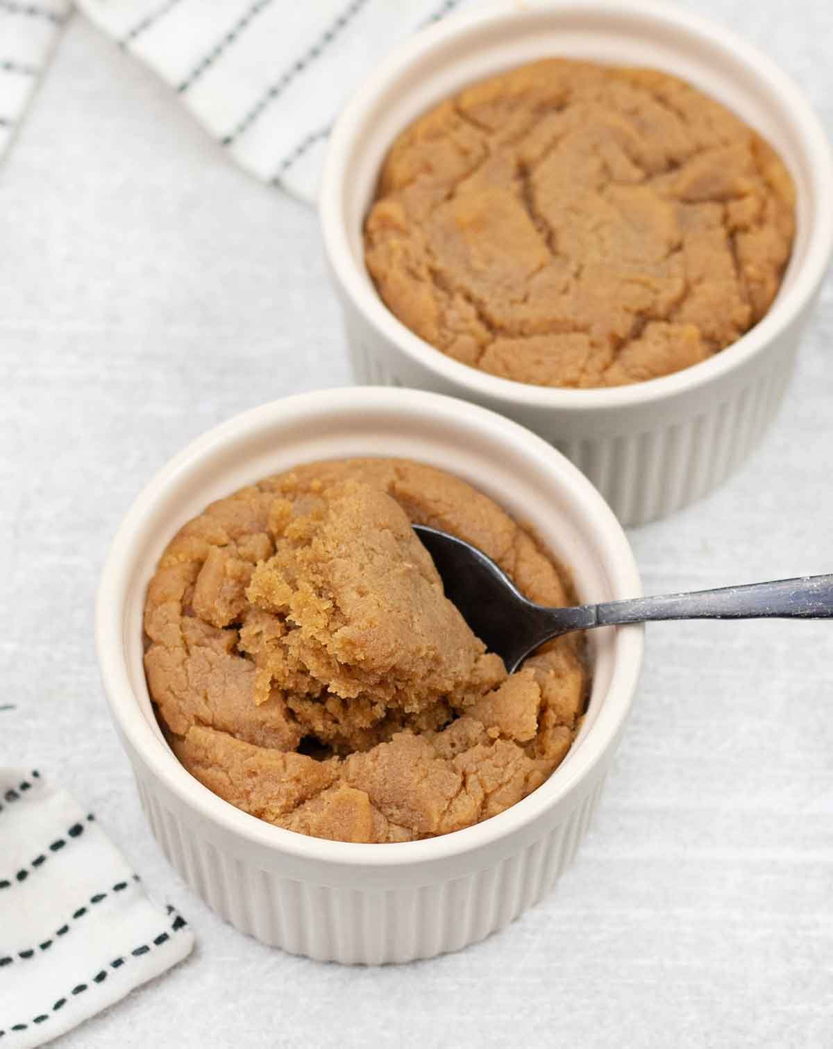 Eating the eggless microwave cookies from the ramekins with a spoon.