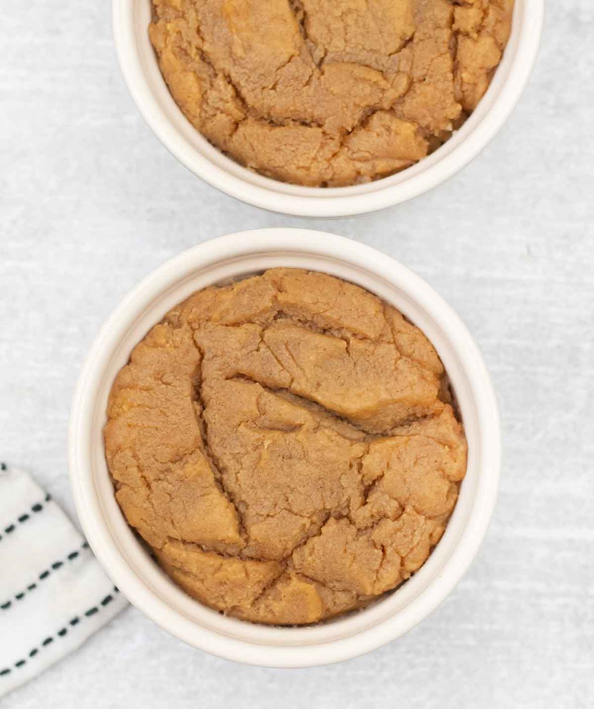 Eggless peanut butter microwave cookies in a mug.