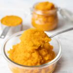 A spoonful of homemade pumpkin puree from scratch.
