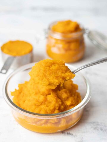 A spoonful of homemade pumpkin puree from scratch.