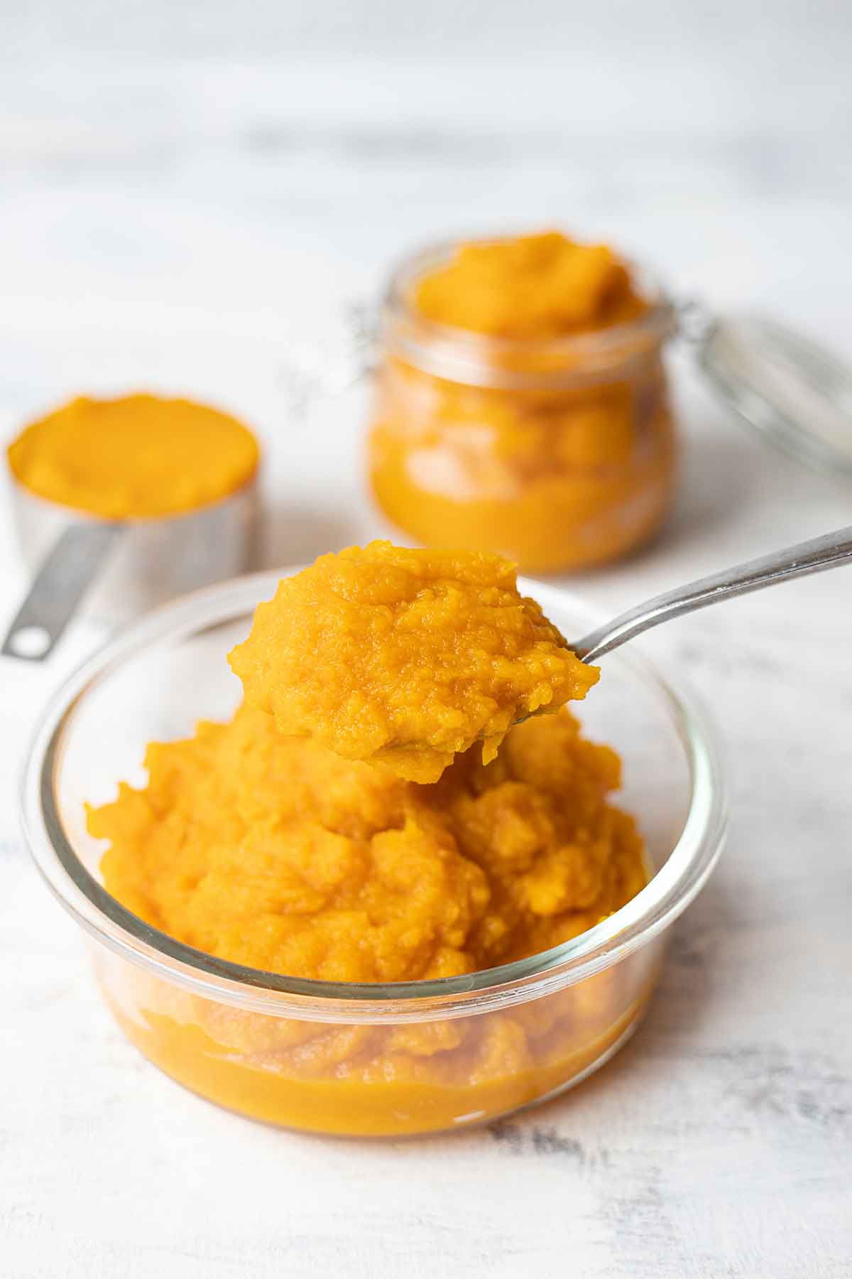 A spoonful of homemade pumpkin puree from scratch.