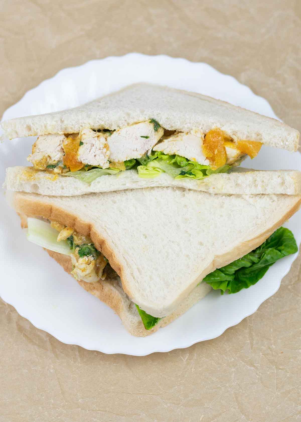 Coronation chicken sandwich in a plate.