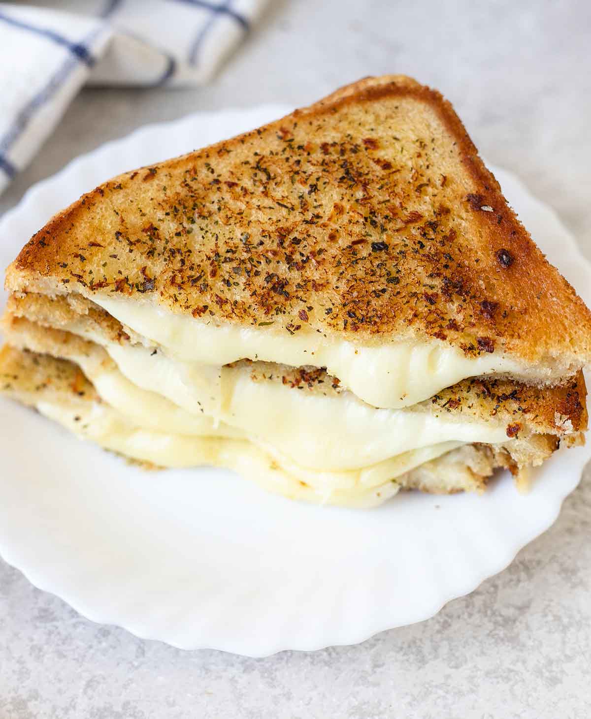 Garlic bread grilled cheese sandwich with gooey melted cheese centre.