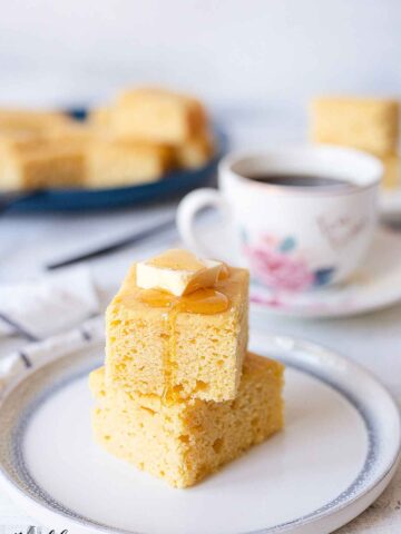 Cornbread cake topped with butter and honey.