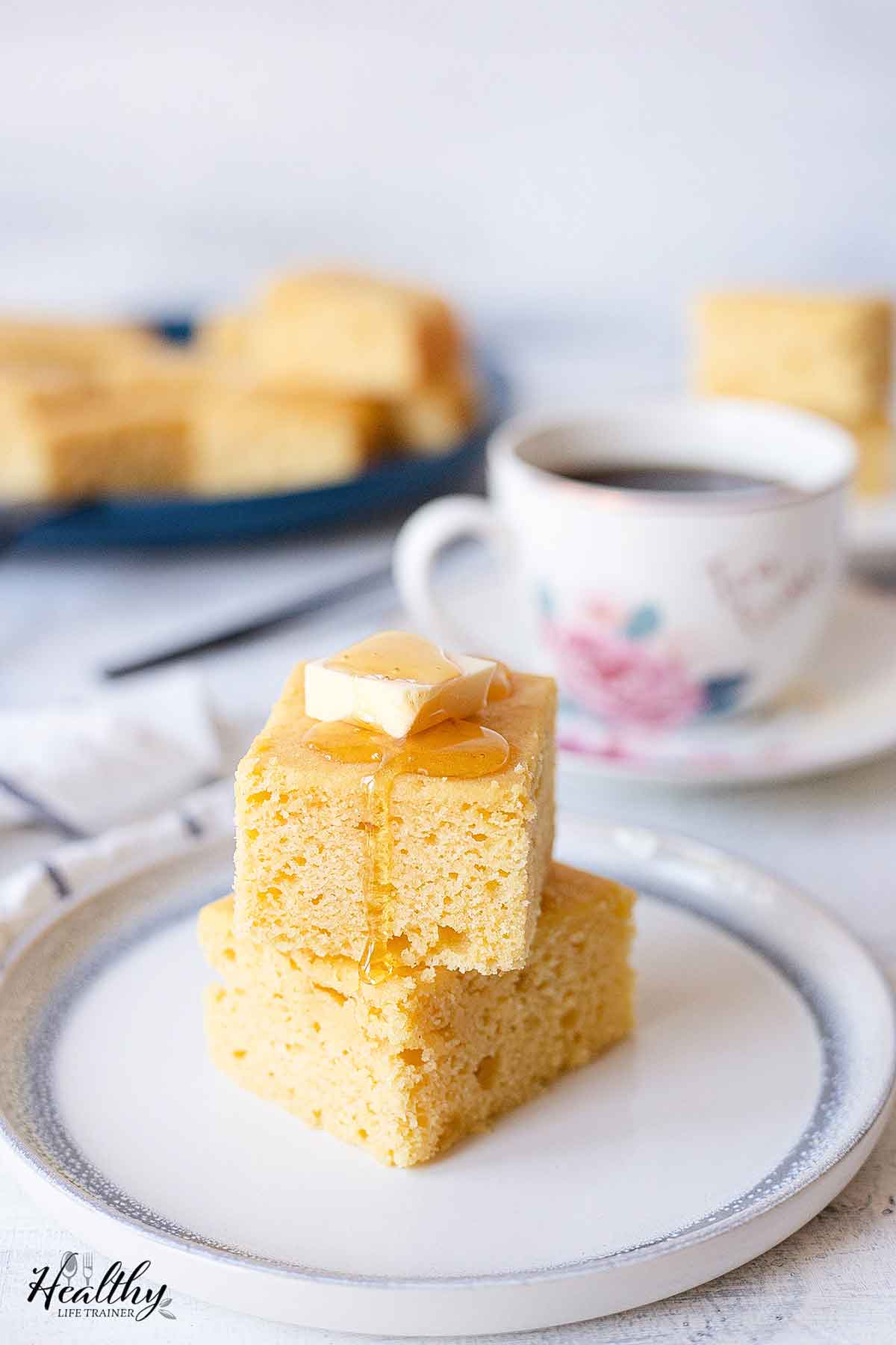 Cornbread cake topped with butter and honey.