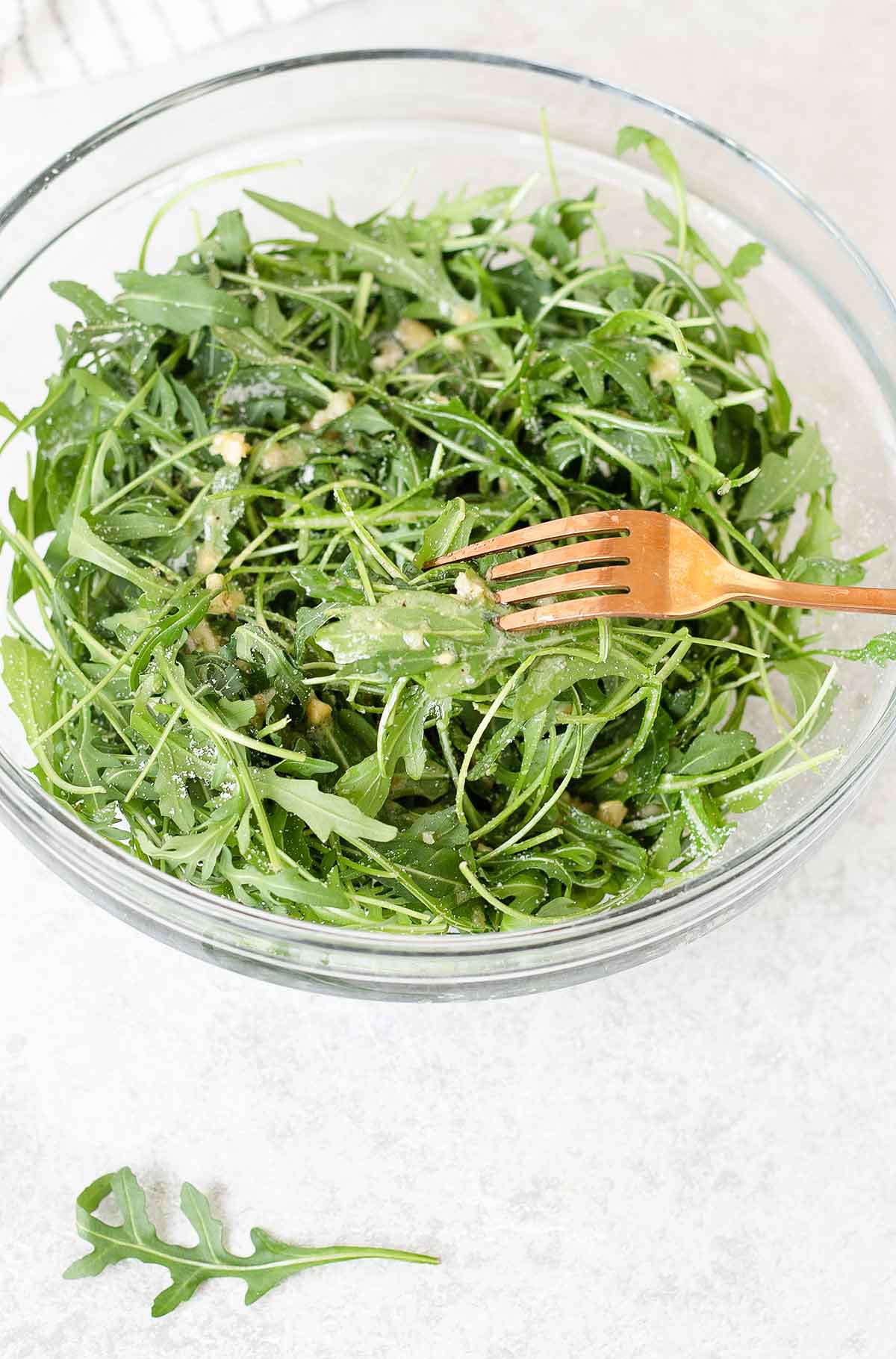 A forkful of arugula salad.