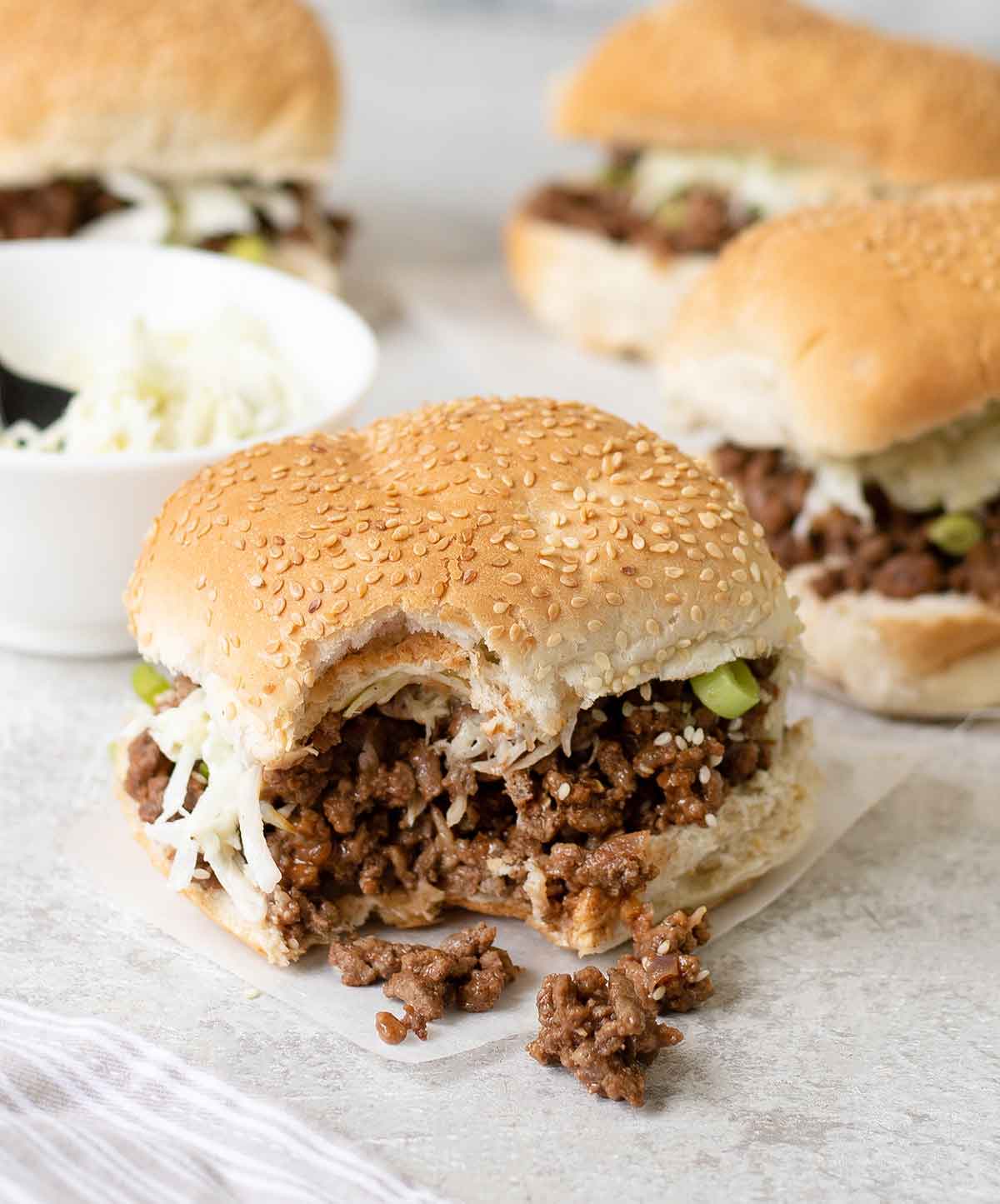 A big bite from the asian sloppy joe sandwich.