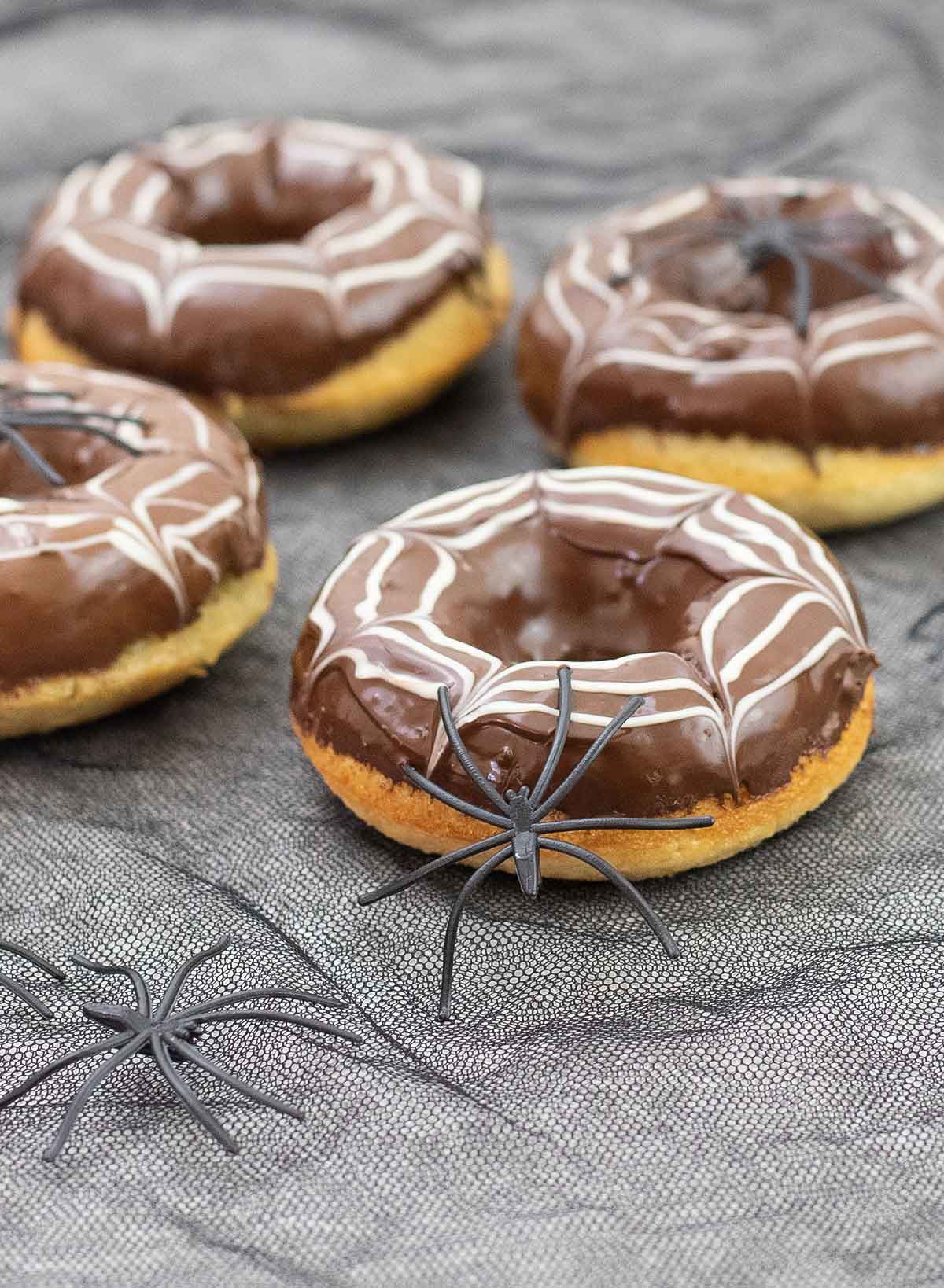 Easy Halloween donuts topped with spiders as a decoration.